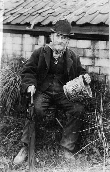 Edward Bingham holding one of his Castle Hedingham Ware designs a English Photographer