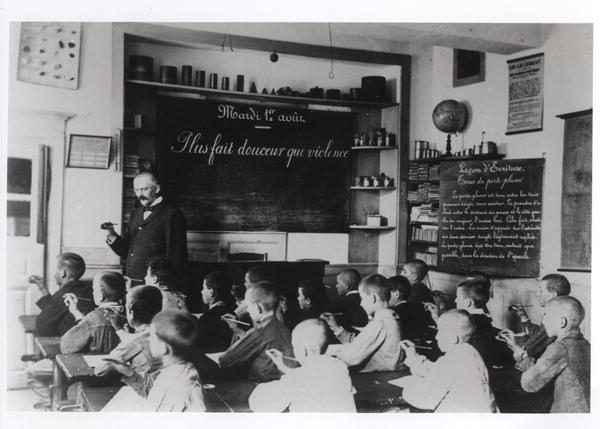 Children in a classroom (b/w photo)  a French Photographer