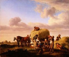 Haymakers resting in a field