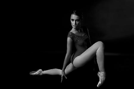 peak of silence. grace and charm of a ballerinas dance in a photo Studio