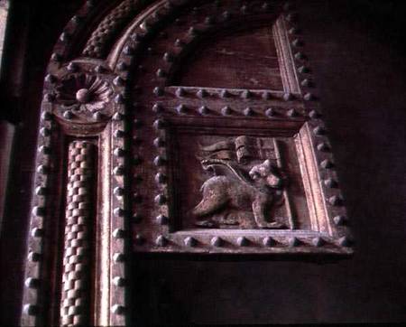 Carved door panel from the Duomoshowing a bear cub carrying a flag a Anonimo