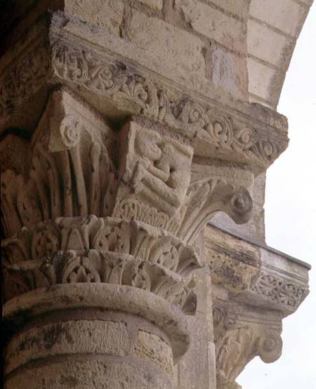 Column capital with stylised foliage designs around the figure of an acrobatfrom the porch exterior a Anonimo