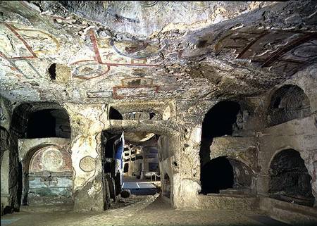Interior of a catacomb chamber cut from tufa stone showing fragments of frescoed decoration a Anonimo