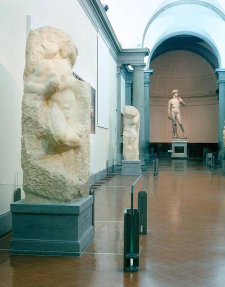Interior view of the gallery with Michelangelo's 'Awakening Slave' and 'David' in the background (ph a Anonimo
