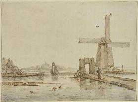 Windmühle auf einem schmalen Damm, vorne drei Enten