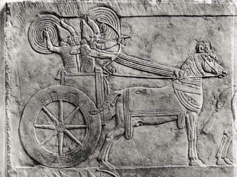 Fragment of a relief depicting the Assyrian army in battle, from the Palace of Ashurbanipal in Ninev a Assyrian