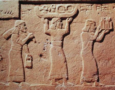 Relief depicting porters laden with gifts a Assyrian