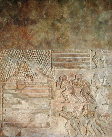 Relief depicting the stocking up of wood on the shore before transportation by sea, from the Palace a Assyrian