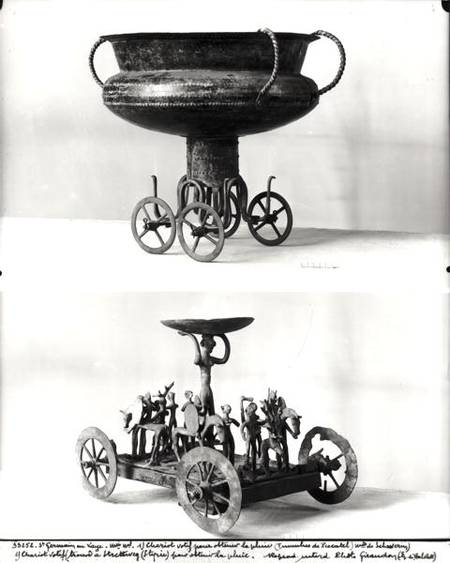 Two votive chariots for collecting rainwater: Top - cup supported on four wheels from the Peccatel t a Bronze  Age