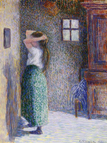 Woman in front of a mirror a Camille Pissarro