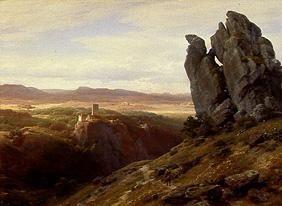 Low mountain range landscape with ruins of a castle
