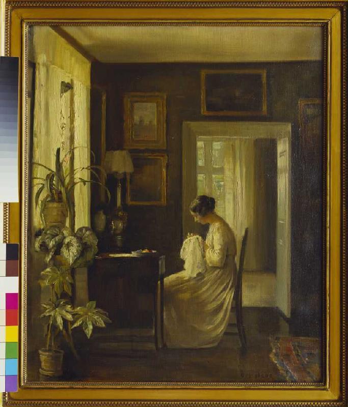 Interior with a sewing woman. a Carl Holsoe