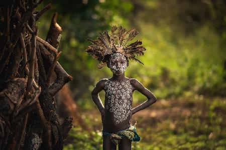 KIBISH, ETHIOPIA - The boy Suri tribe with traditional dress.