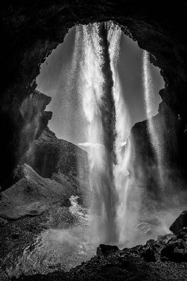 behind the waterfall