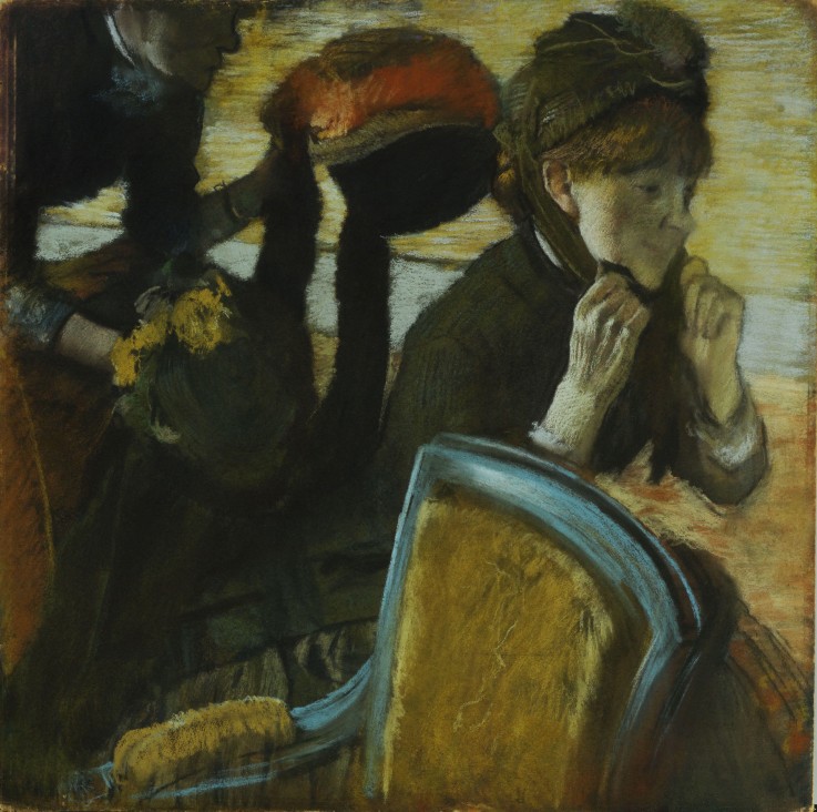 At the Milliner's a Edgar Degas