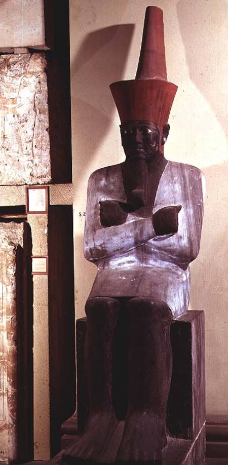 Statue of Mentuhotep II, enthroned and wearing the red crown of Lower Egypt, taken from the Mortuary a Egizi