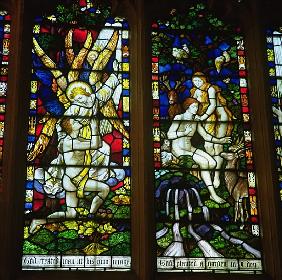 Stained glass windows depicting (LtoR) The Annunciation and Adam and Eve in the Garden of Eden