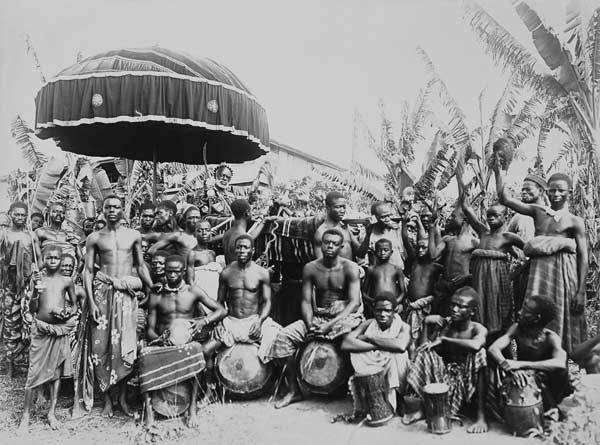 Ashantee King Carried by Slaves under State Umbrella Surrounded by Followers, c.1890 (b/w photo) a English School, (19th century)