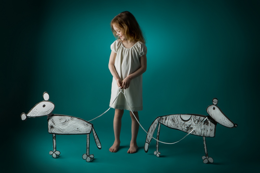 Girl with her dogs a Eva Miliuniene