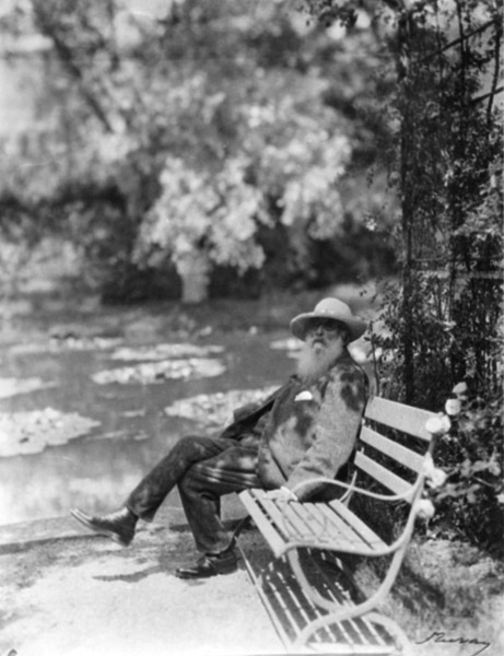 Claude Monet (1841-1926) in his garden at Giverny, c.1920 (b/w photo) a French Photographer, (20th century)