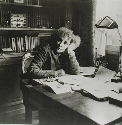 Portrait of Sidonie Gabrielle Colette (1873-1954), in her study (b/w photo) a French School, (20th century)