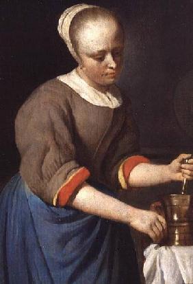 Young girl with a pestle and mortar