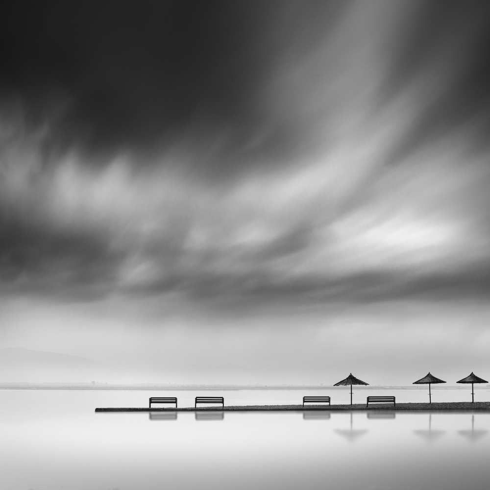 Four Benches and three umbrellas a George Digalakis