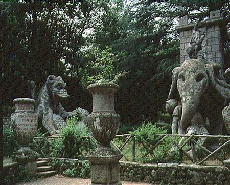 One of Hannibal's elephants and a dragon fighting with a lion, sculptures from the Parco dei Mostri a Giacomo Barozzi da Vignola