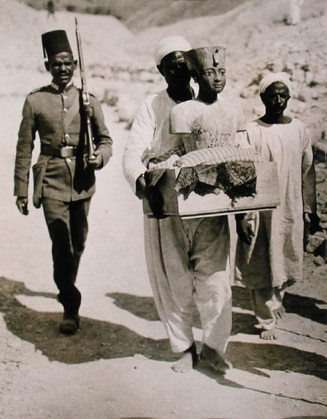 The mannequin or bust of Tutankhamun being carried from the tomb, Valley of the Kings, 1922 (gelatin a Harry Burton