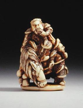 Netsuke in the form of a Chinese warrior on horseback with his attendant