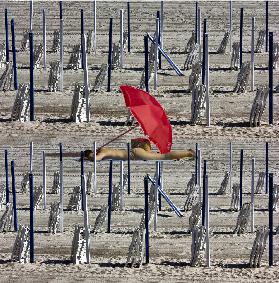 Composition of poles and chairs with red umbrella