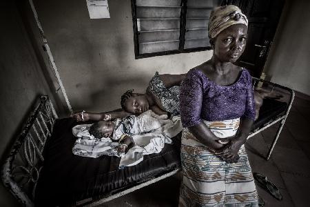 A grandmother takes her granddaughter to visit her sick daughter - Ghana