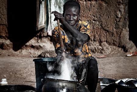 Making food for her children - Benin
