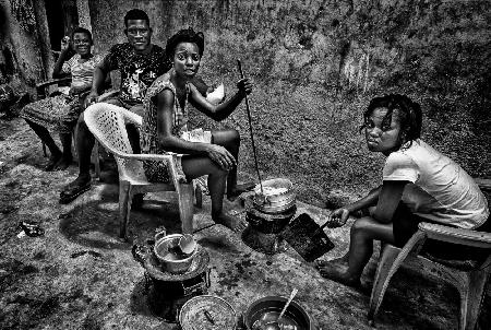 Preparing food on a street of the old Buduburam refugee camp - Ghana
