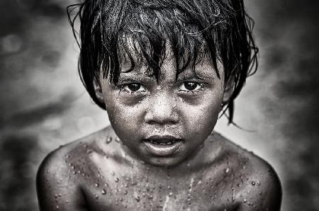 Rohingya refugee child playing with water - Bangladesh