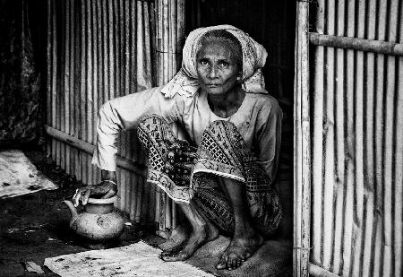 Rohingya woman at the entrance of her home - Bangladesh