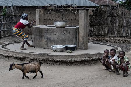 Drawing water from the well in a little village in Benin