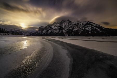 Moonrise on a frozen lake