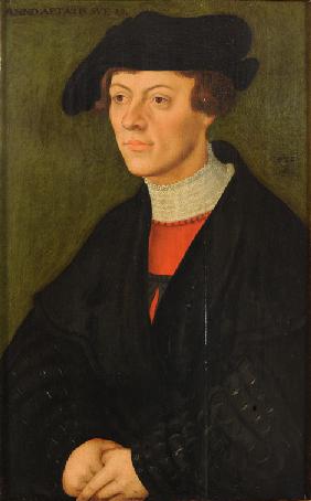 Portrait of a 19-year-old young man in black clothes