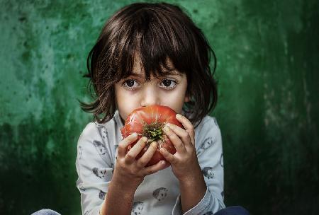 The Child with Tomato