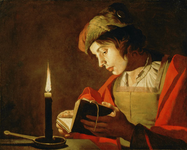Young Man Reading by Candle Light a Matthias Stomer