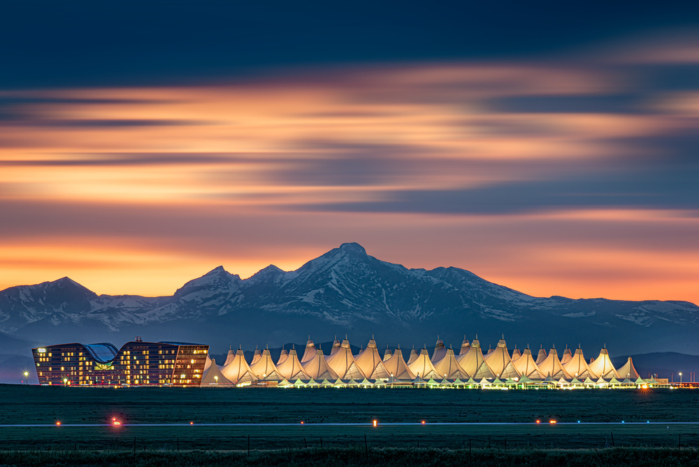 Denver International Airport in dusk with Longs Peak as background a Mei Xu