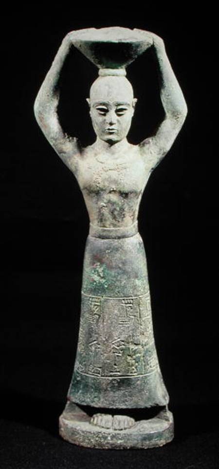 Statuette of an offering bearer with a votive inscription, from Uruk, Protoliterate Period a Mesopotamian