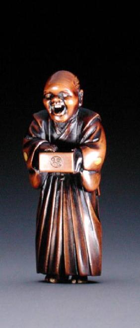 Netsuke depicting a standing priest