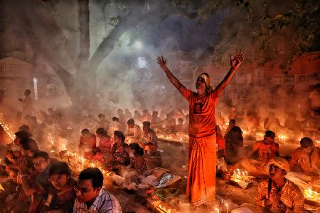 Praying with candle