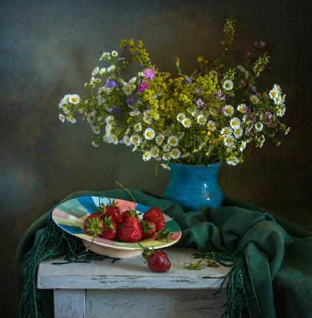 still life with wildflowers and strawberries.