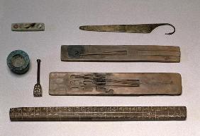 A scribe's instruments (wood, ivory, bronze and enamel)
