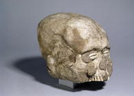 Portrait skull with cowrie shell eyes, Jericho, c.7th millennium BC (skull, plaster and shell) (side