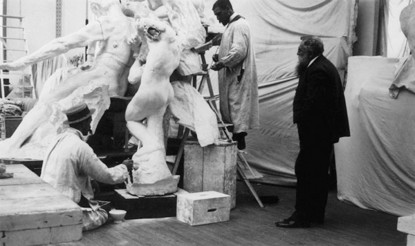Auguste Rodin (1840-1917) in his Paris studio watching the construction of a sculpture, 1905 (b/w ph a 
