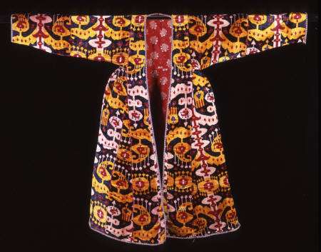 A Coat Of Silk Velvet Ikat,  Woven With Rams horns And Combed Motifs Against A Deep Green Ground, 18 a 